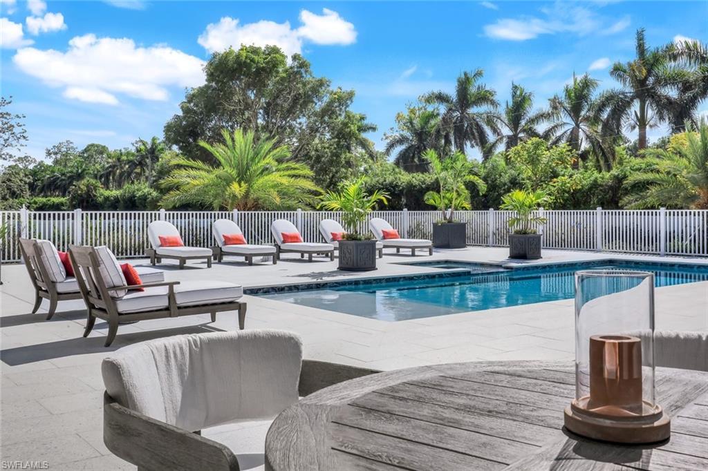 3136 Ravenna Avenue Naples, FL 34120 - Photo 5 of 50 a view of a chairs and table in patio