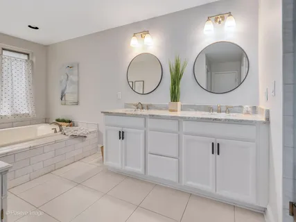 a white toilet sitting next to a bathroom sink