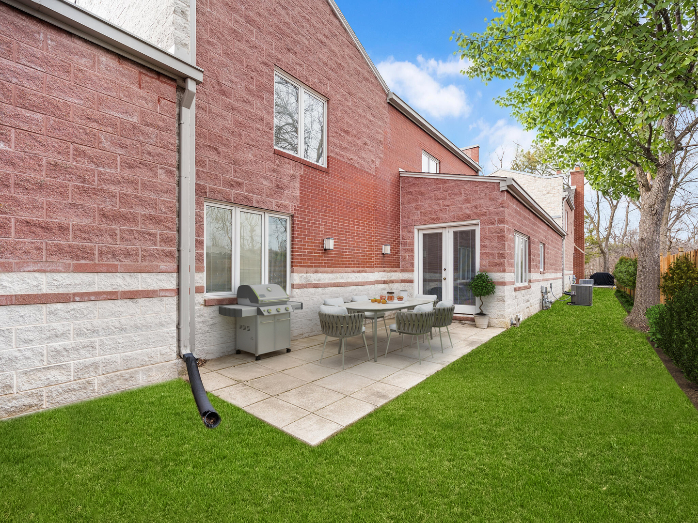 11 Manchester Lane Elmhurst, IL 60126 - Photo 25 of 29 a front view of a house with patio and garden