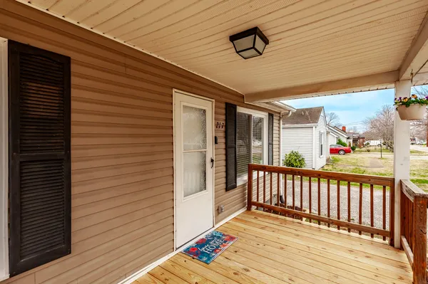 a view of a porch with wooden floor