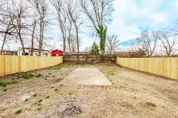 a view of a backyard with trees