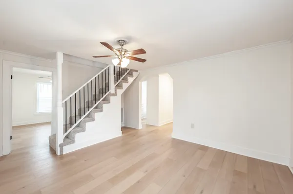 a view of entryway and hall with wooden floor