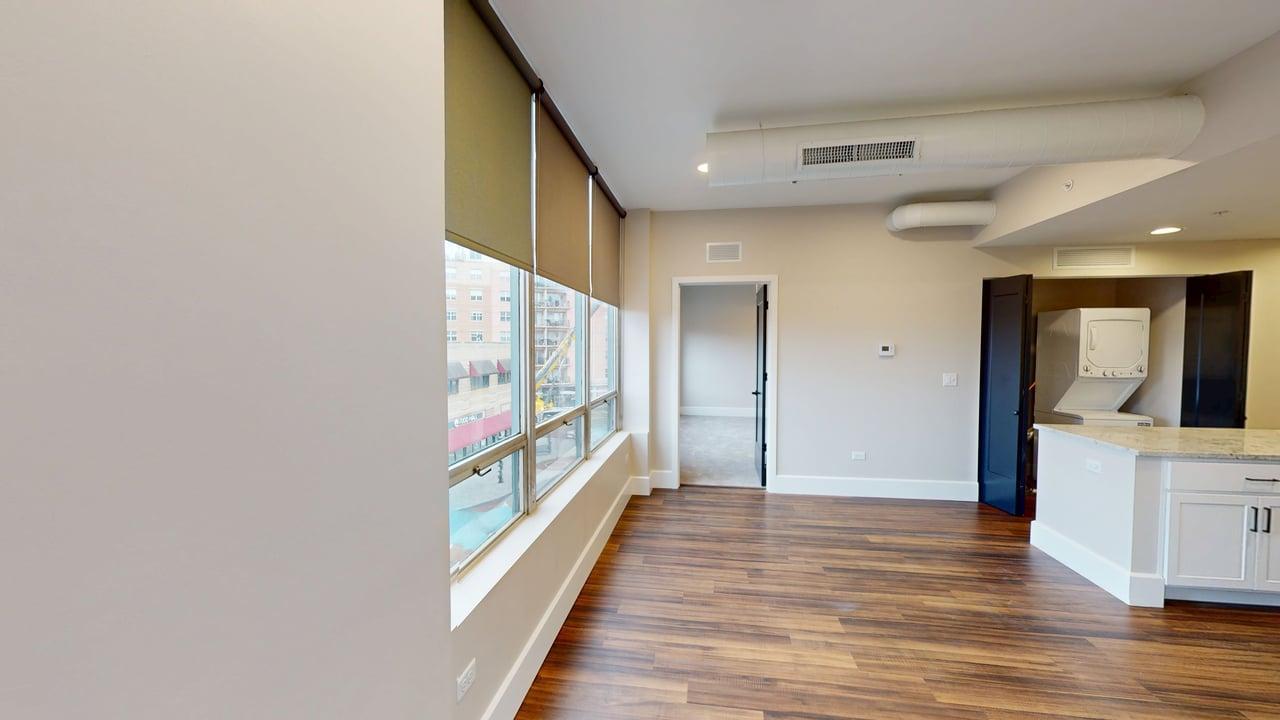 40 Dupage Court, Unit 309 Elgin, IL 60120 - Photo 11 of 18 a view of a hallway with wooden floor and staircase