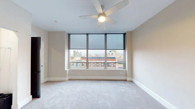 a view of a patio with a chairs and table potted plants