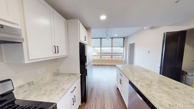 a view of wooden floor and windows in a room