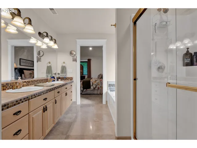 a large bathroom with a sink and a mirror