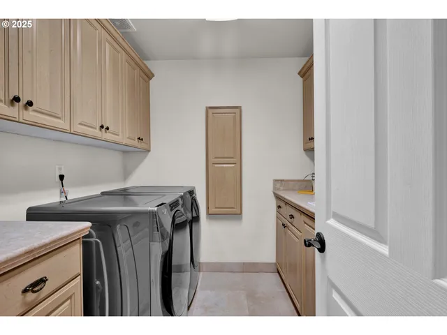 a utility room with closet dryer and washer