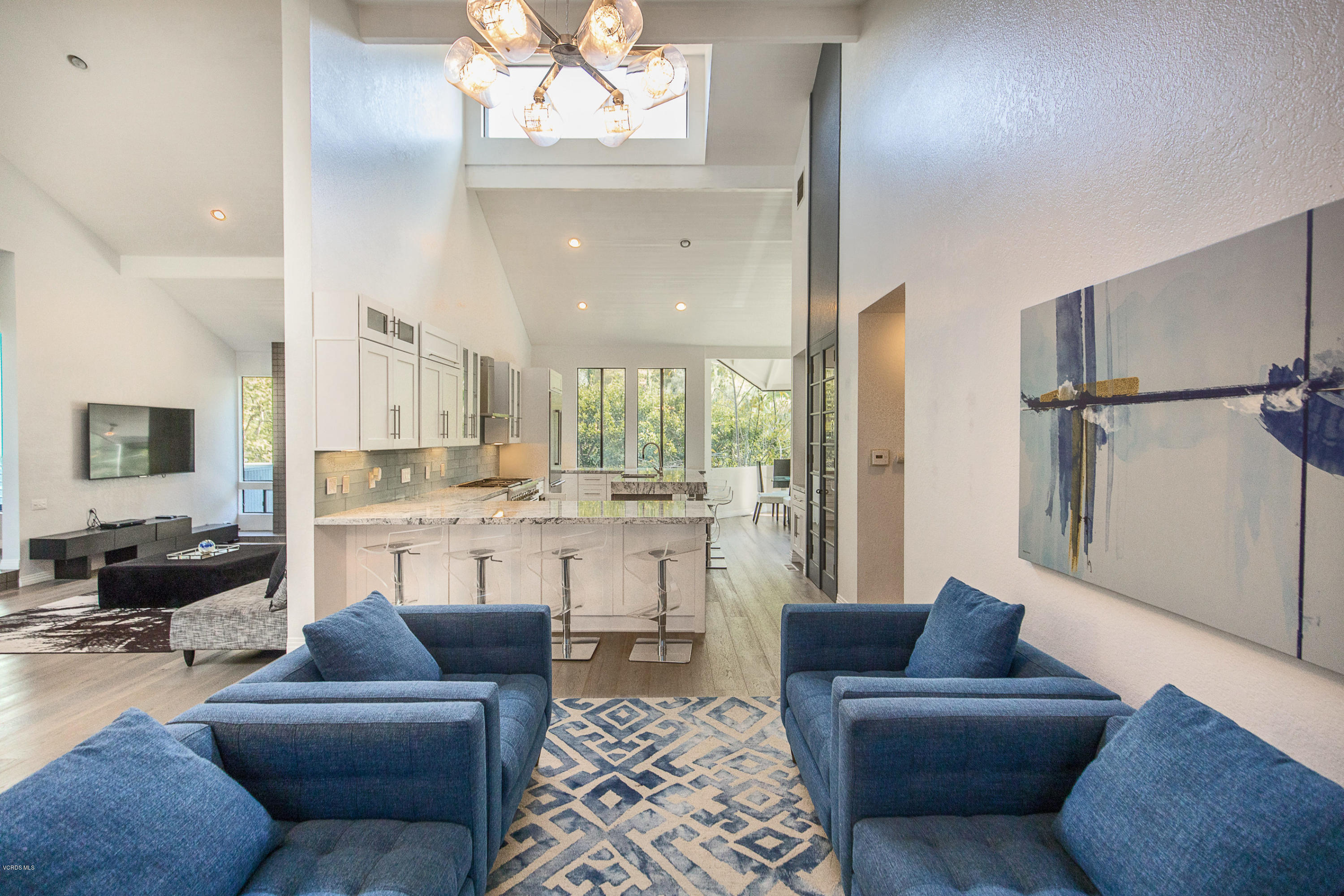 2001 Roscomare Road Los Angeles, CA 90077 - Photo 11 of 52 a living room with furniture and a large window