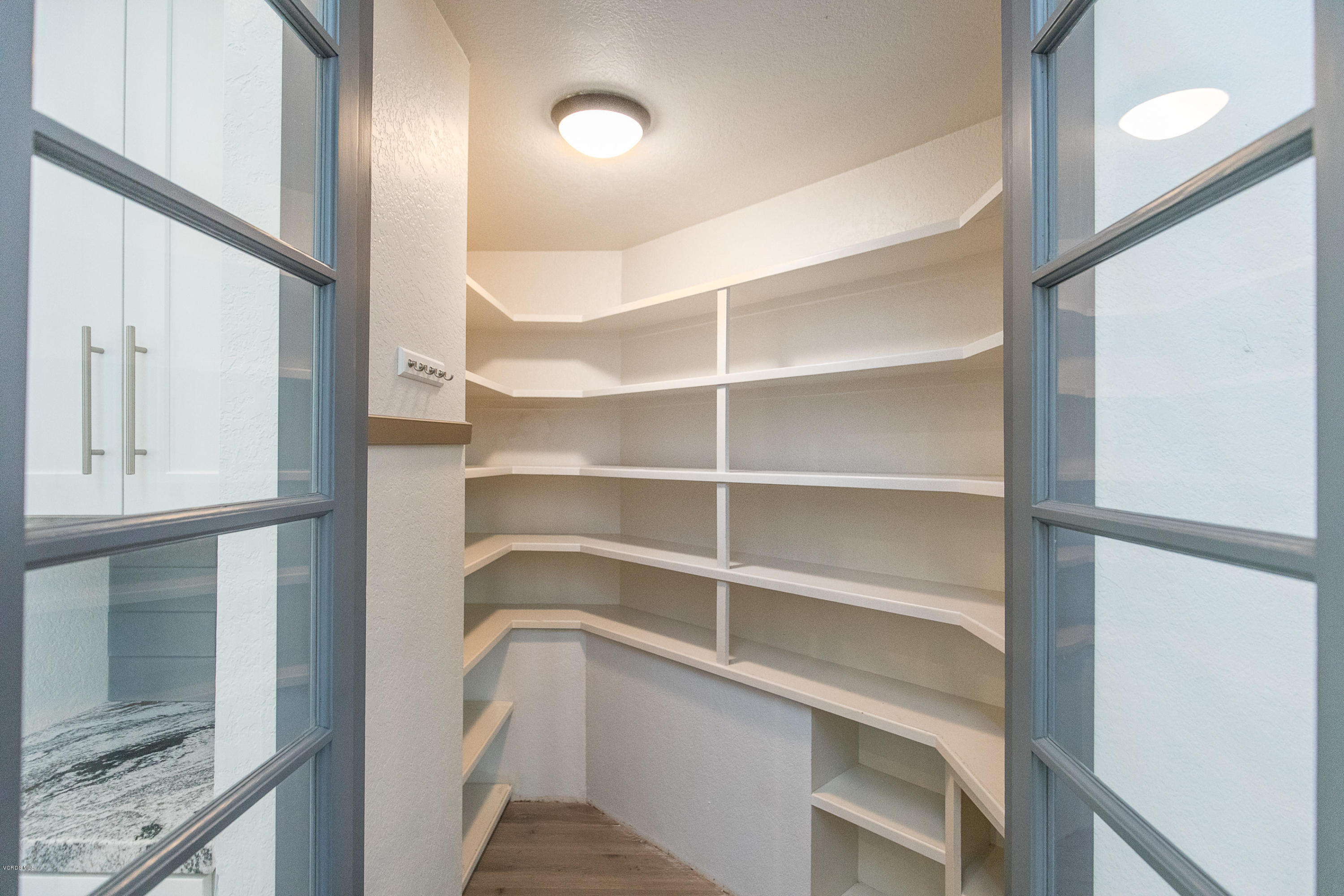 2001 Roscomare Road Los Angeles, CA 90077 - Photo 18 of 52 a view of walk in closet with empty racks
