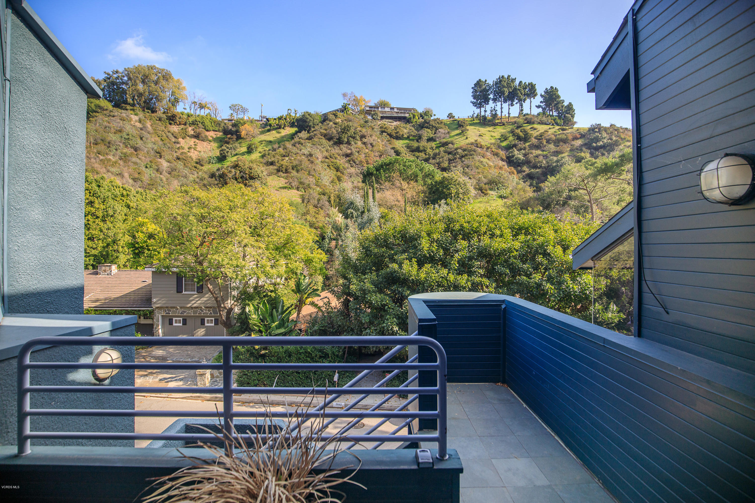 2001 Roscomare Road Los Angeles, CA 90077 - Photo 3 of 52 a view of a balcony with chairs