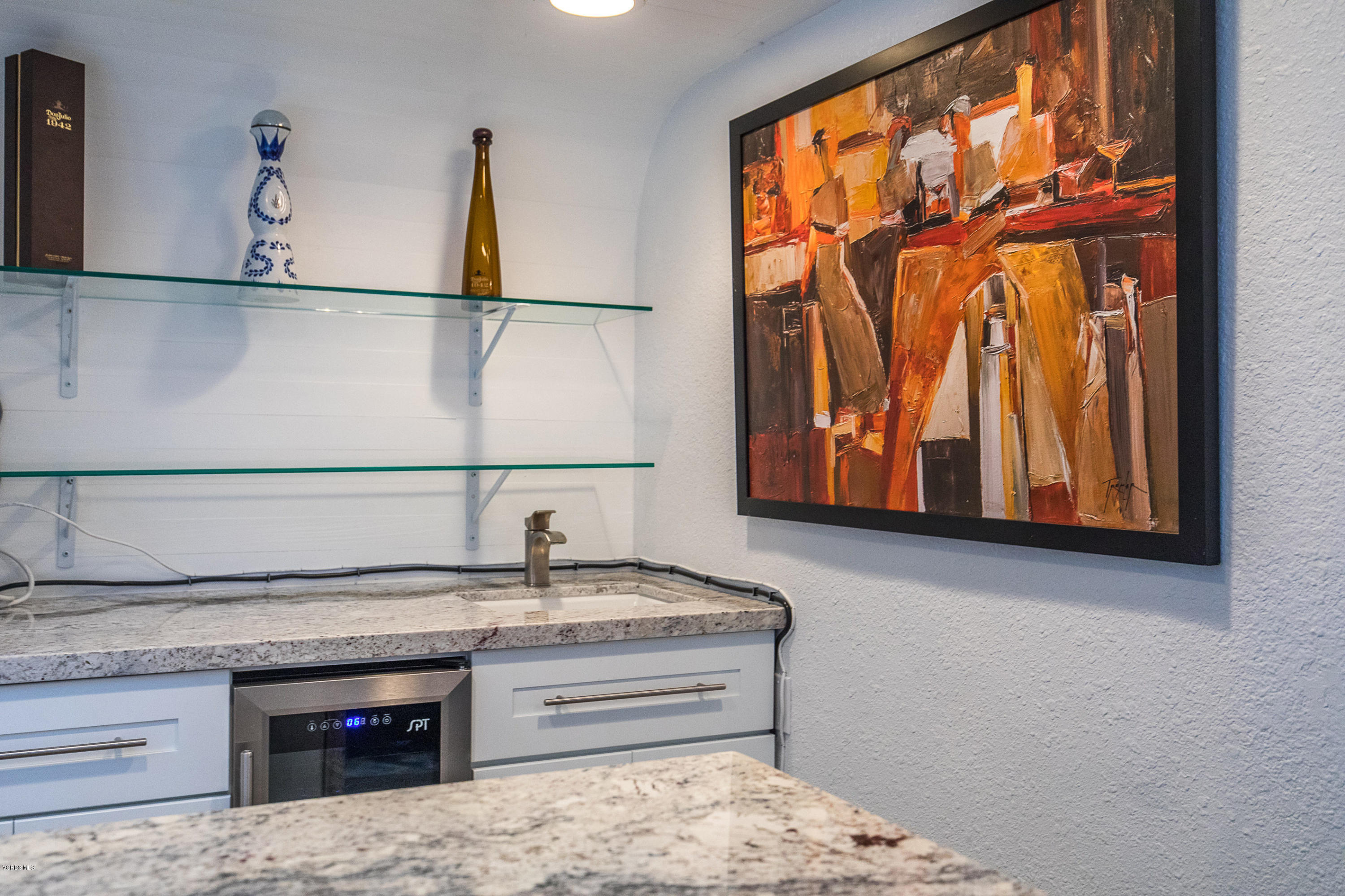 2001 Roscomare Road Los Angeles, CA 90077 - Photo 21 of 52 a bathroom with a sink and a mirror