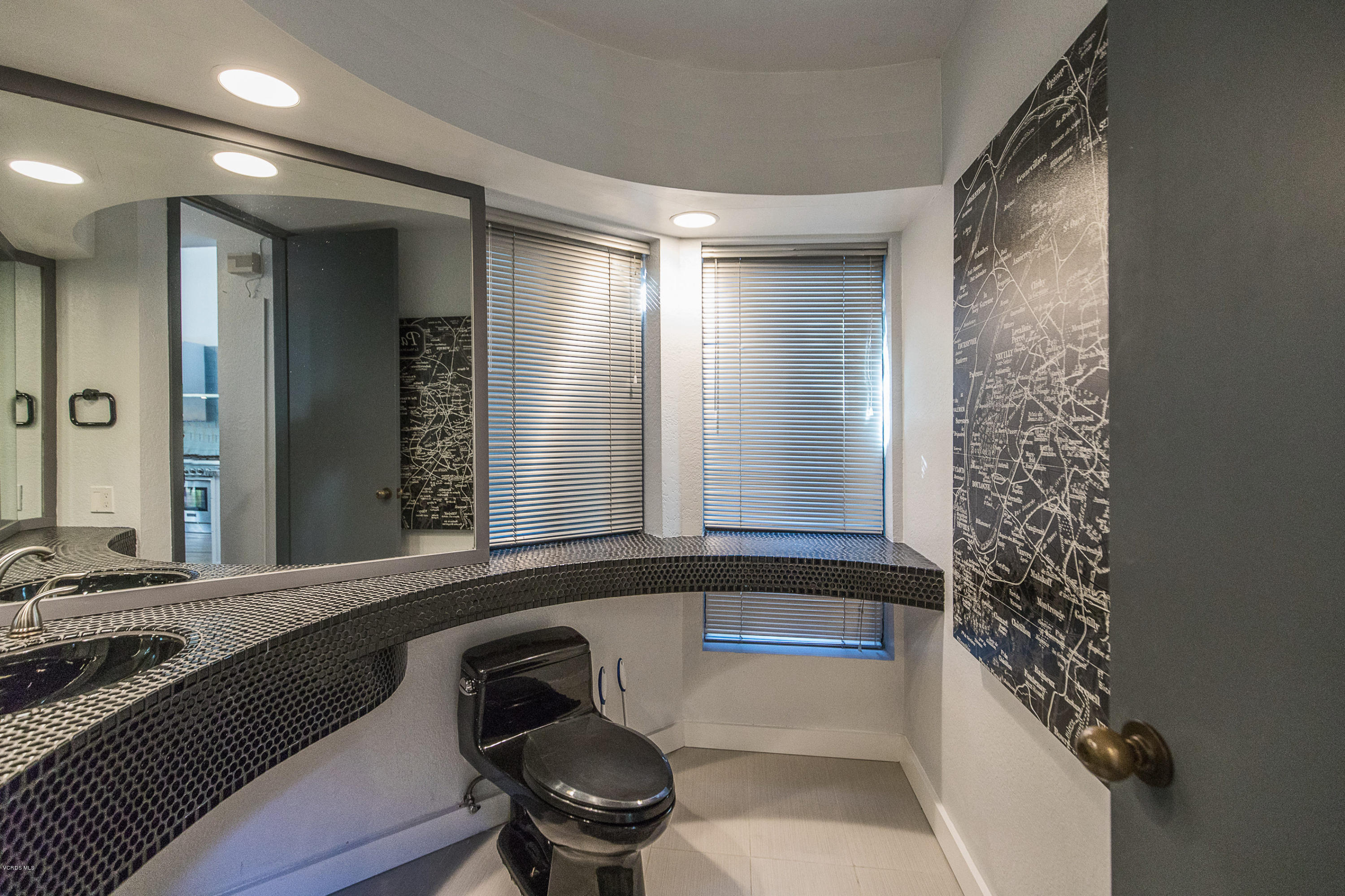 2001 Roscomare Road Los Angeles, CA 90077 - Photo 22 of 52 a bathroom with a bathtub and a sink