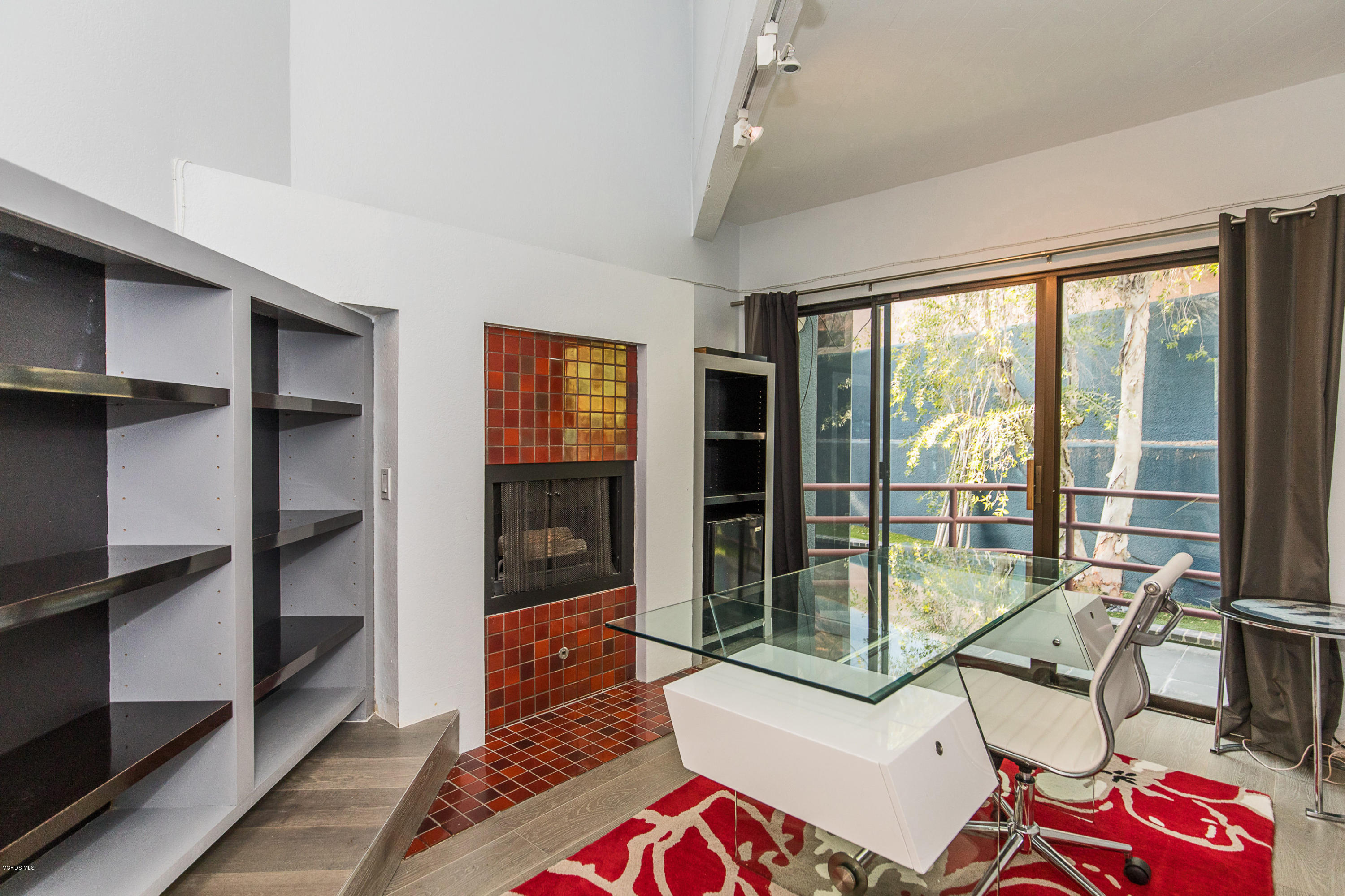 2001 Roscomare Road Los Angeles, CA 90077 - Photo 28 of 52 a living room with furniture and large windows