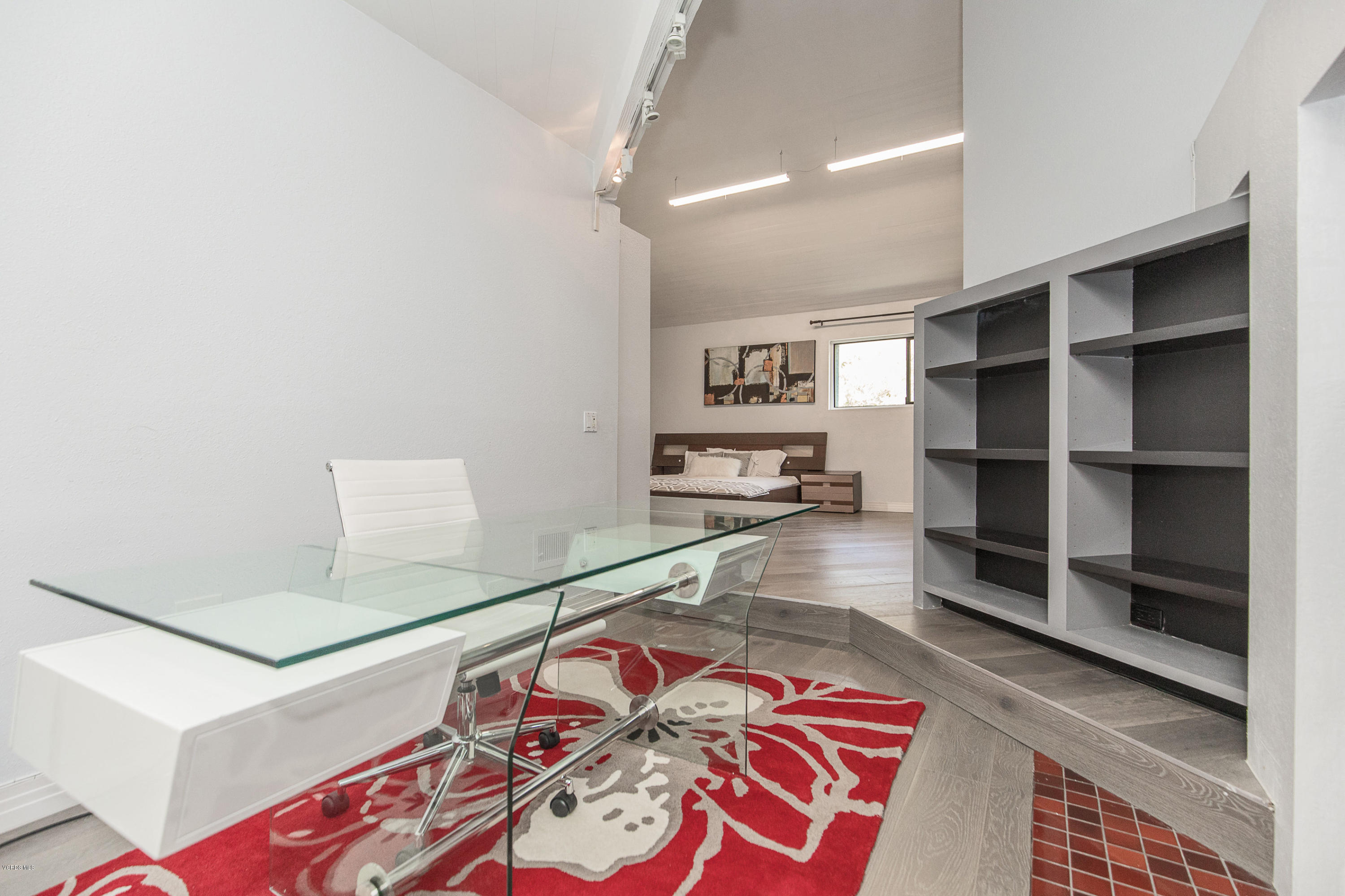 2001 Roscomare Road Los Angeles, CA 90077 - Photo 29 of 52 a living room with furniture and a flat screen tv