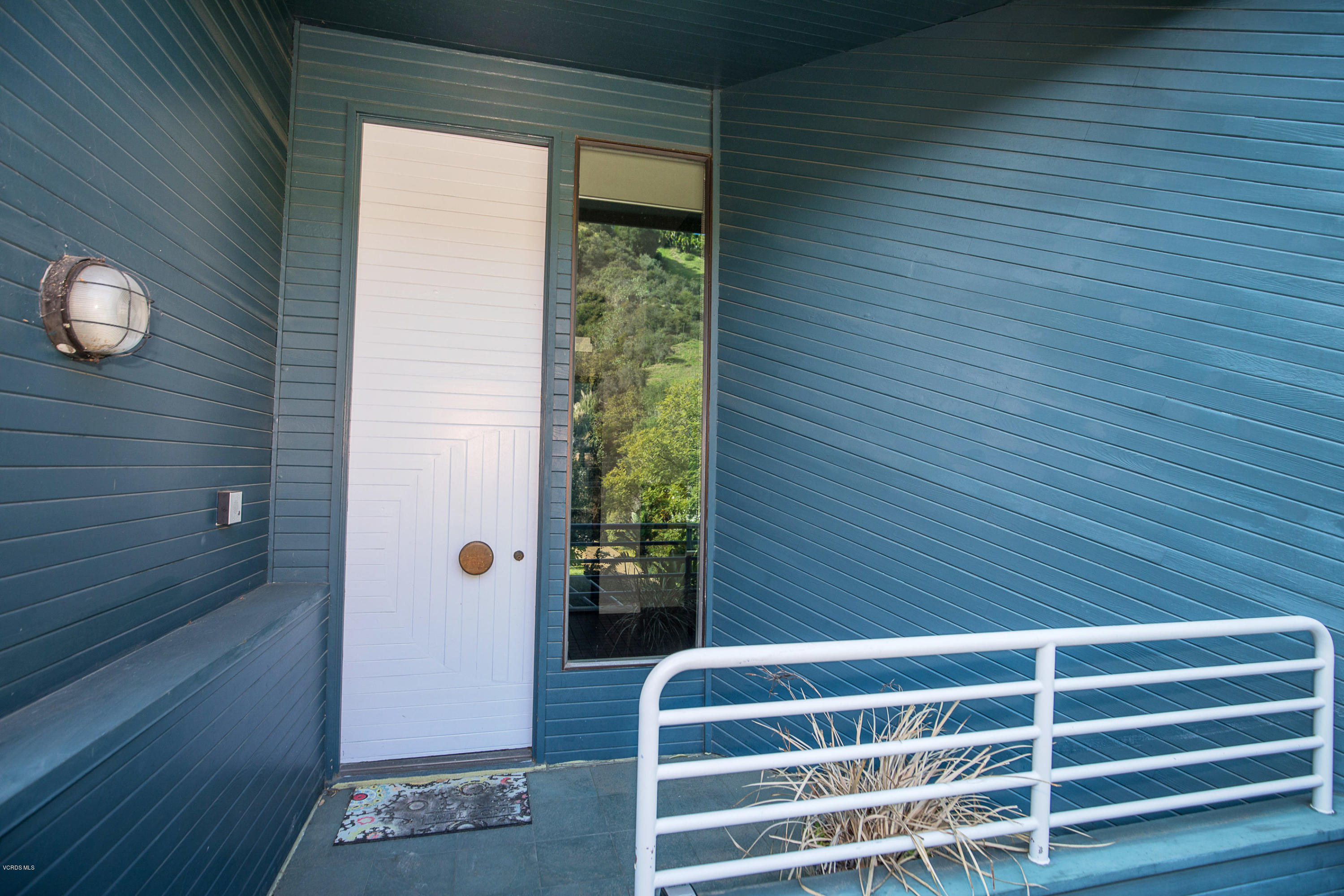 2001 Roscomare Road Los Angeles, CA 90077 - Photo 4 of 52 a view of wooden door with a bench