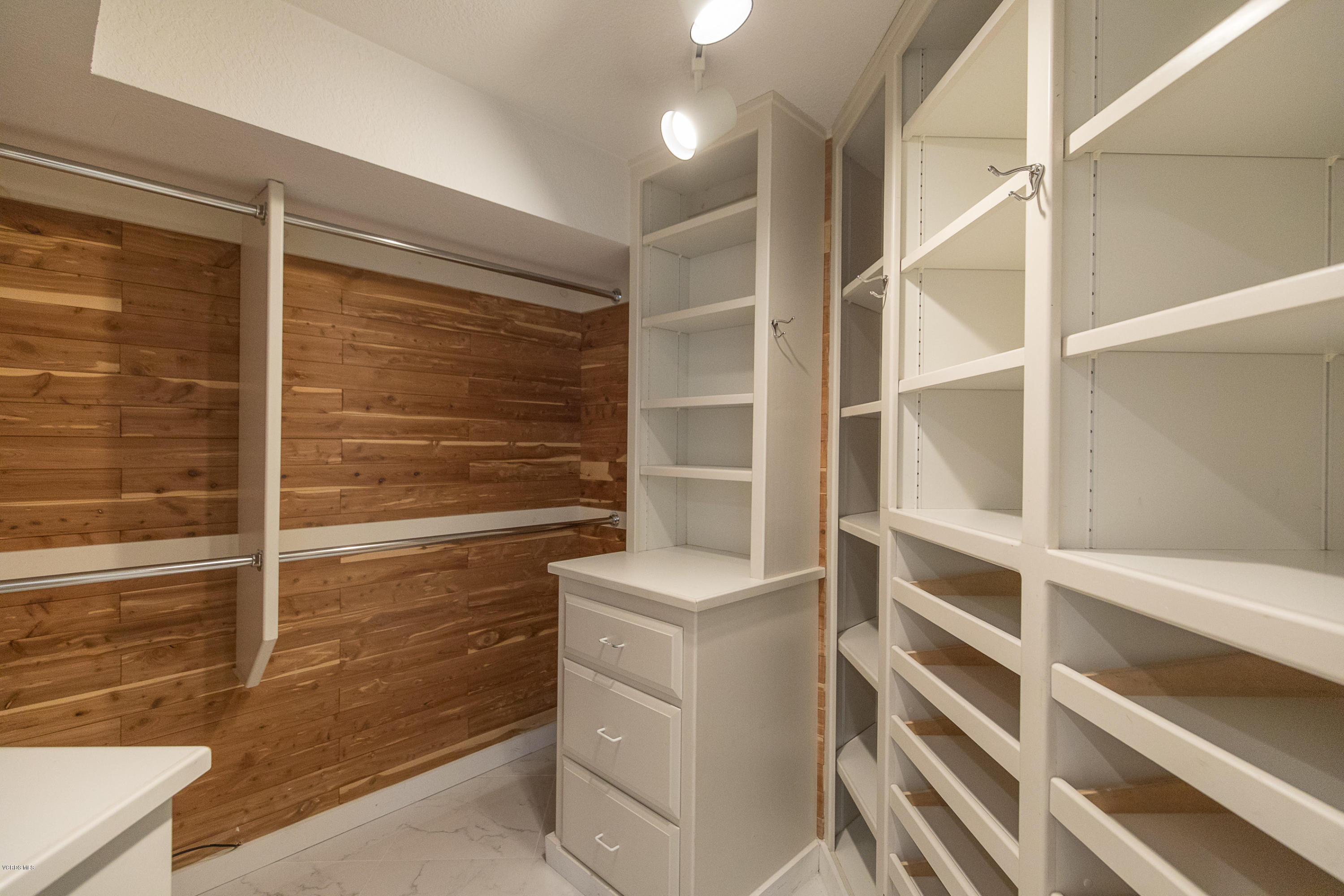 2001 Roscomare Road Los Angeles, CA 90077 - Photo 33 of 52 a view of walk in closet with empty racks