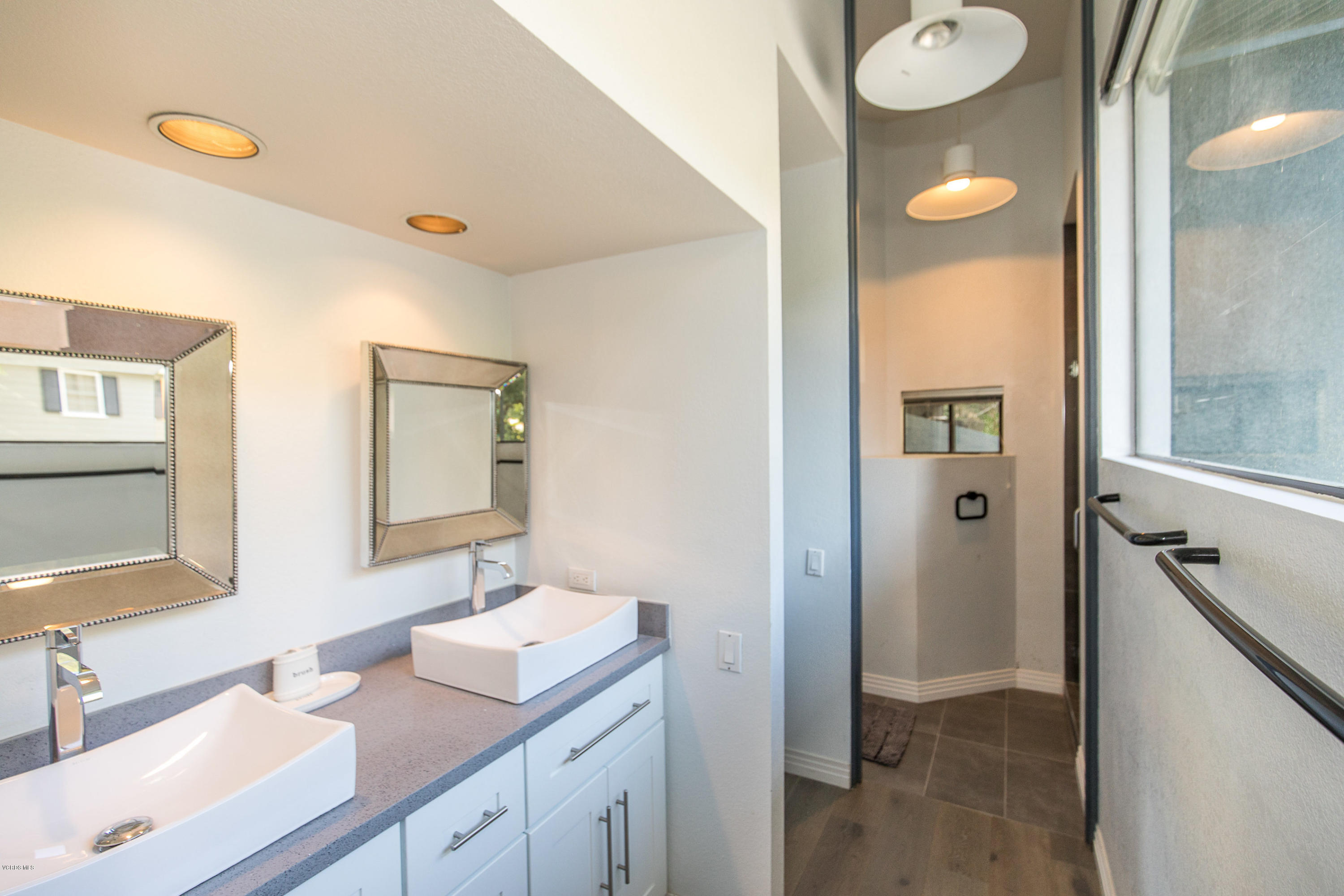 2001 Roscomare Road Los Angeles, CA 90077 - Photo 37 of 52 a bathroom with a sink and mirror