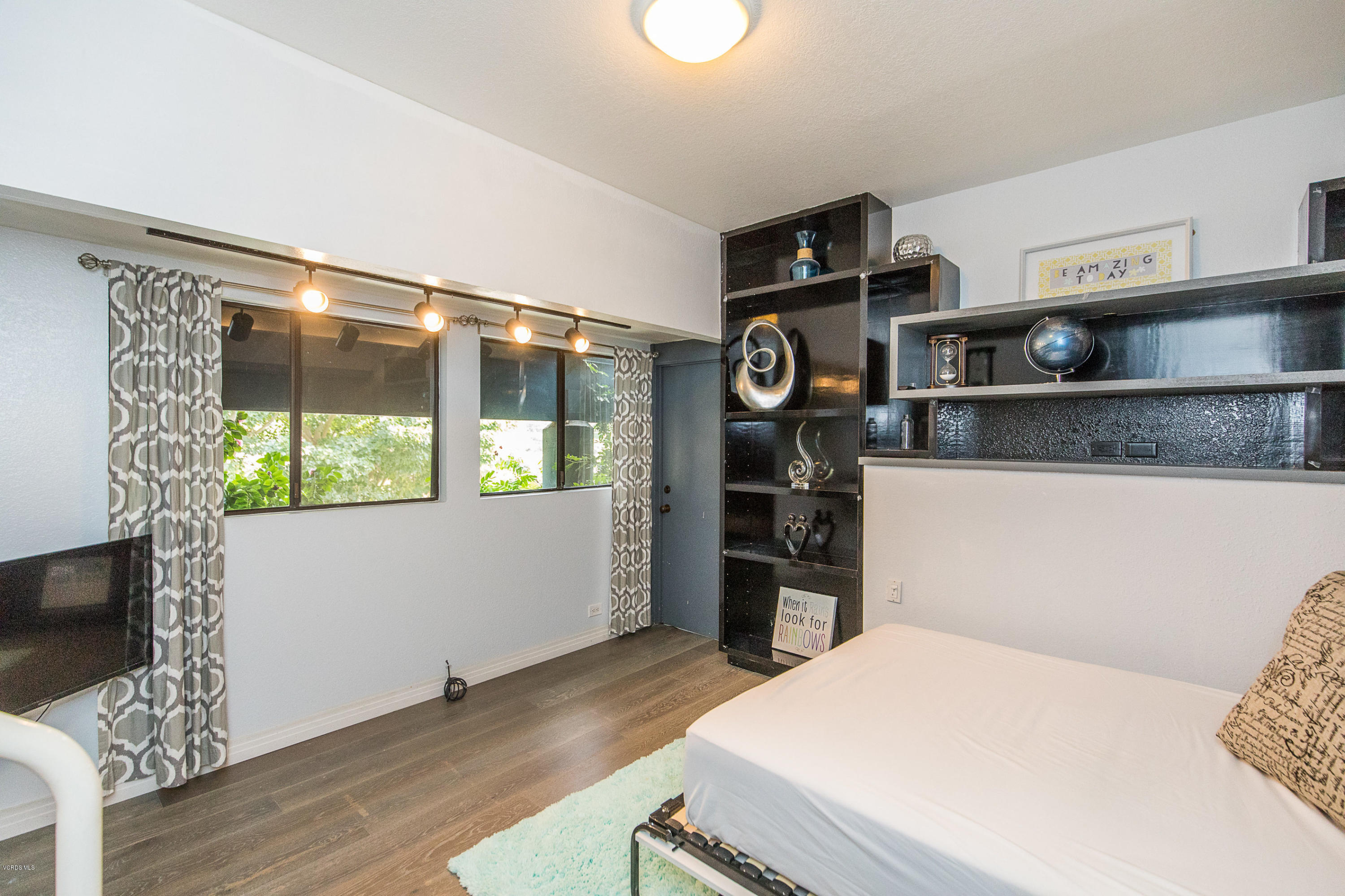 2001 Roscomare Road Los Angeles, CA 90077 - Photo 41 of 52 a bedroom with a bed and a fireplace