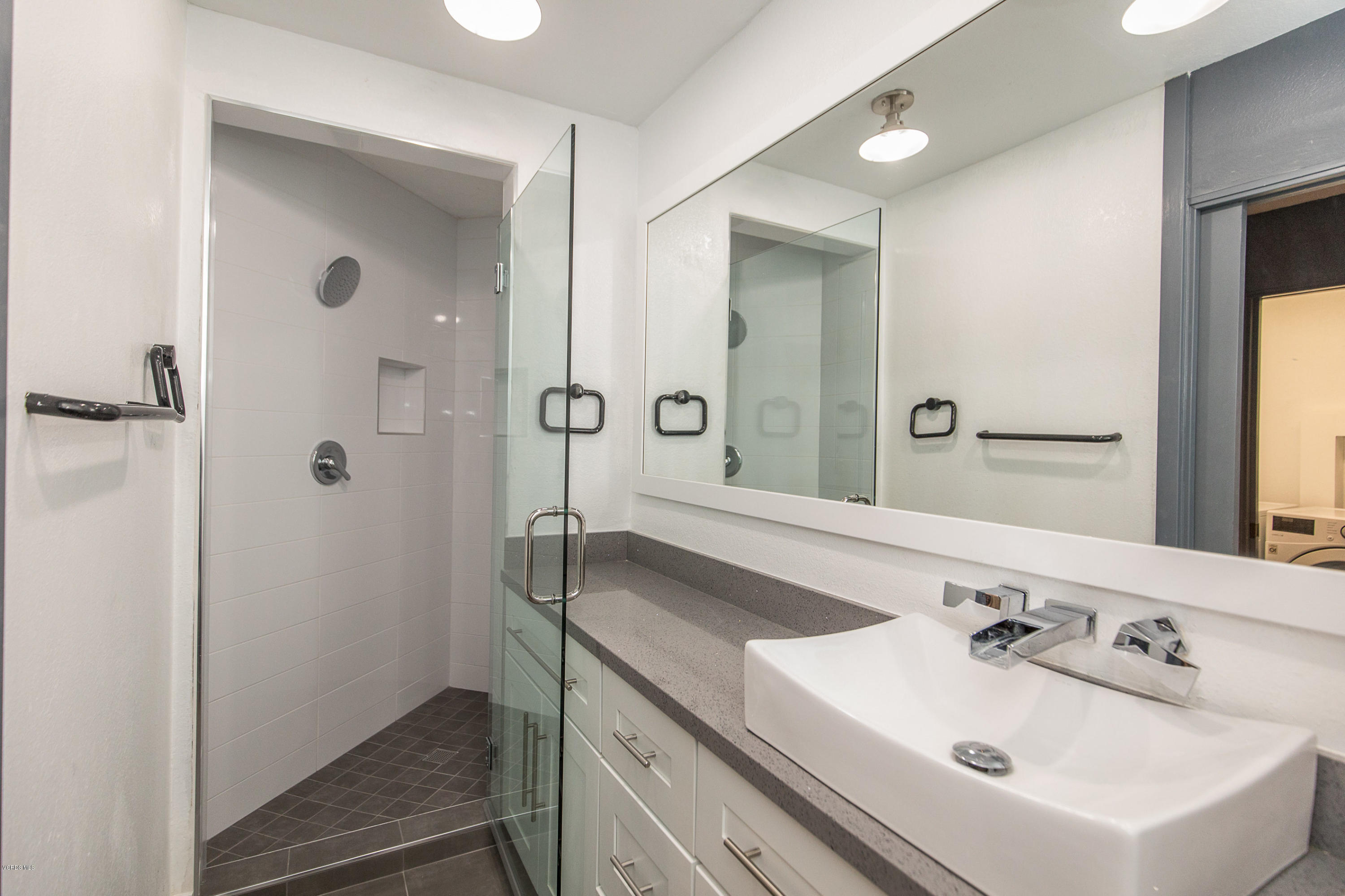 2001 Roscomare Road Los Angeles, CA 90077 - Photo 42 of 52 a bathroom with a sink and a mirror