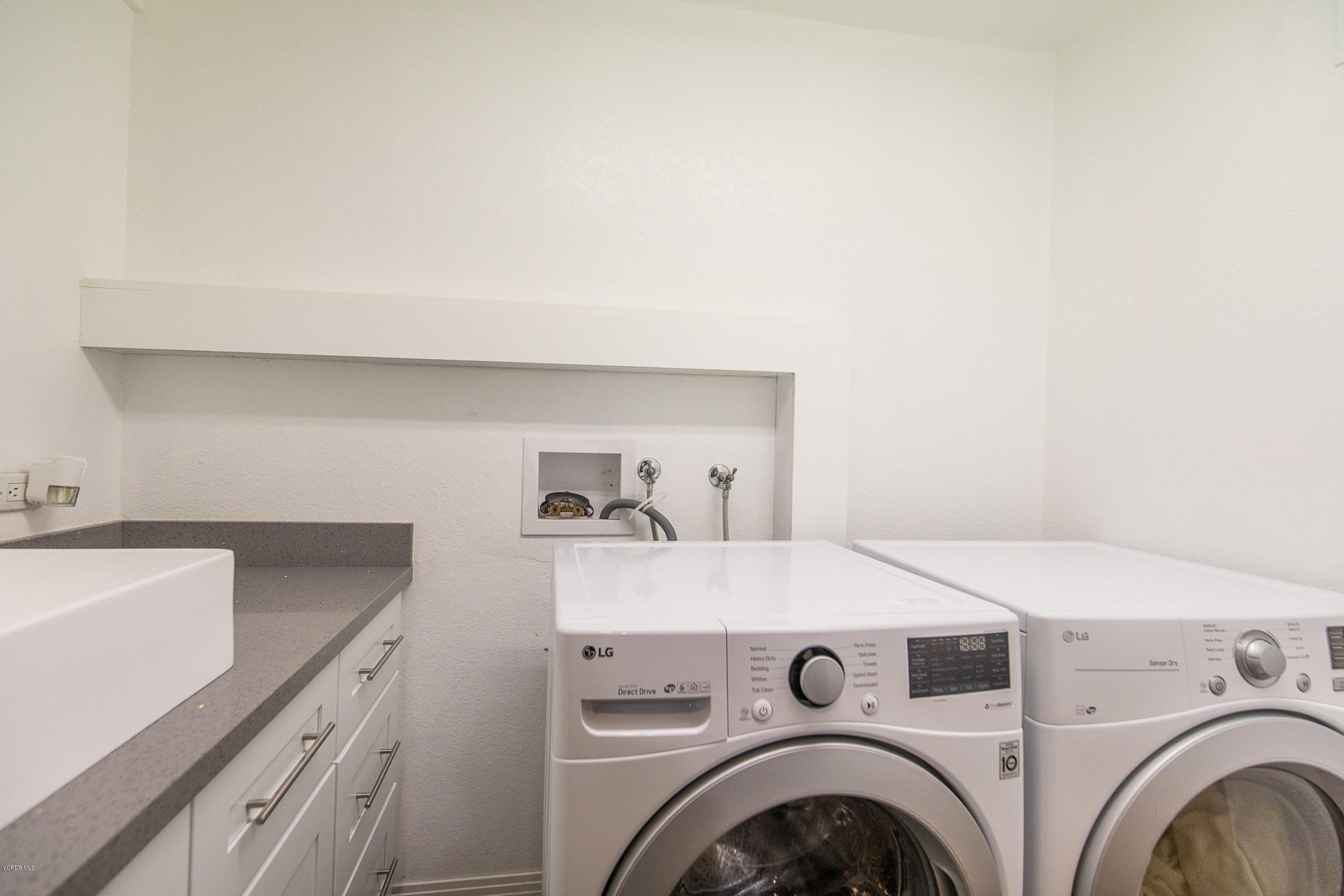 2001 Roscomare Road Los Angeles, CA 90077 - Photo 43 of 52 a utility room with dryer and washer