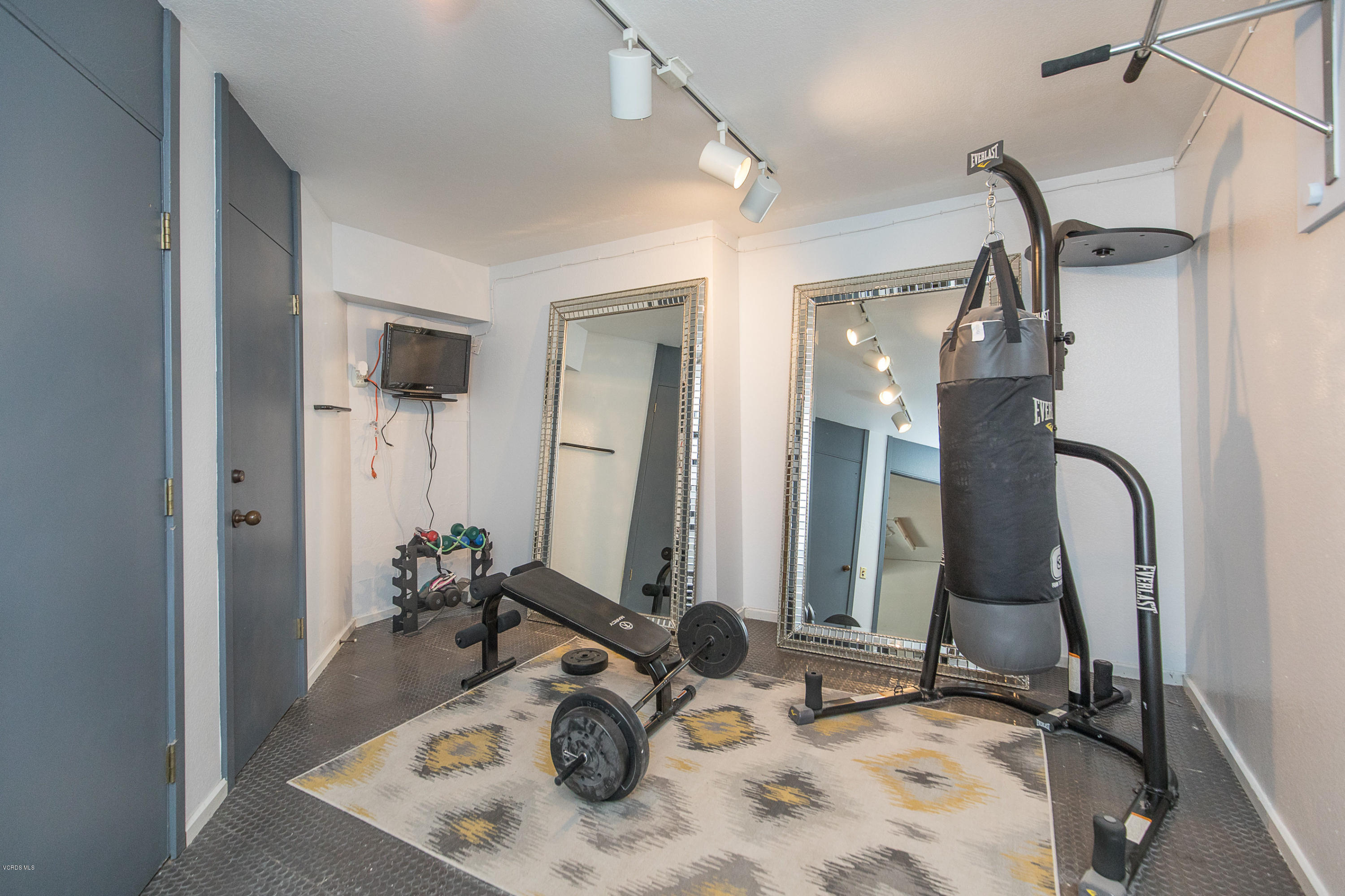 2001 Roscomare Road Los Angeles, CA 90077 - Photo 44 of 52 a bathroom with a double vanity sink mirror and shower