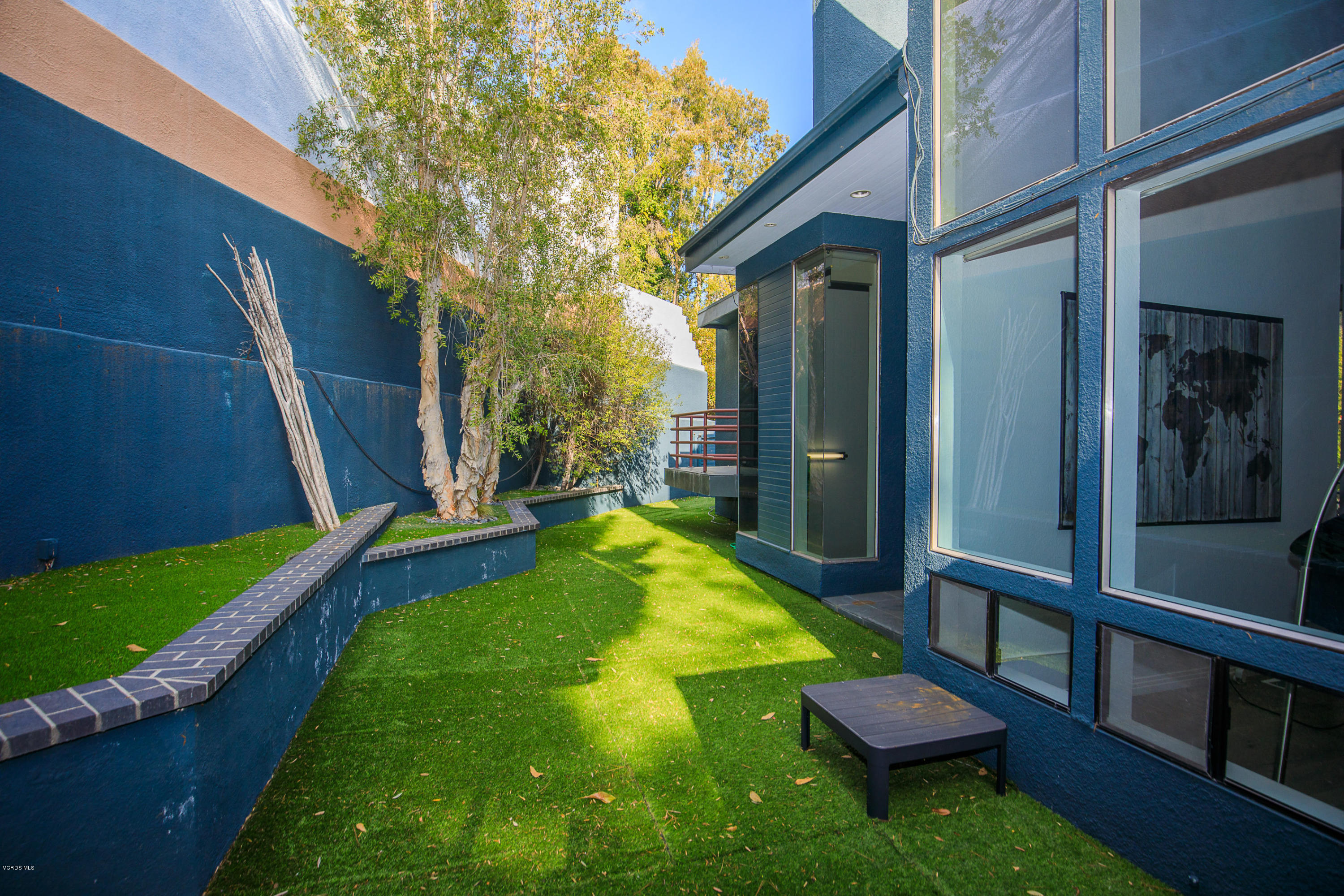 2001 Roscomare Road Los Angeles, CA 90077 - Photo 47 of 52 a view of swimming pool with a backyard