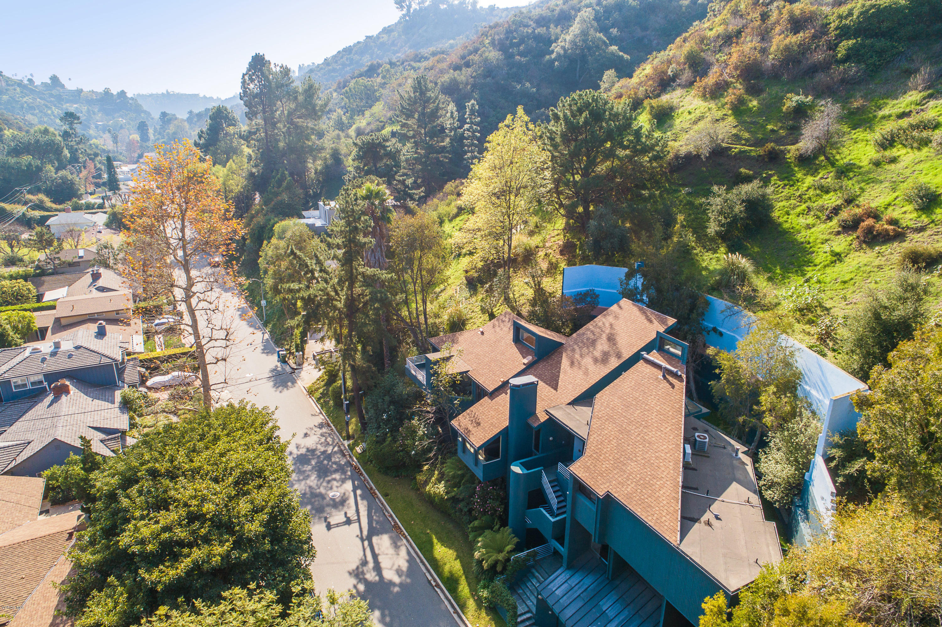 2001 Roscomare Road Los Angeles, CA 90077 - Photo 50 of 52 an aerial view of a house with a yard and lake view