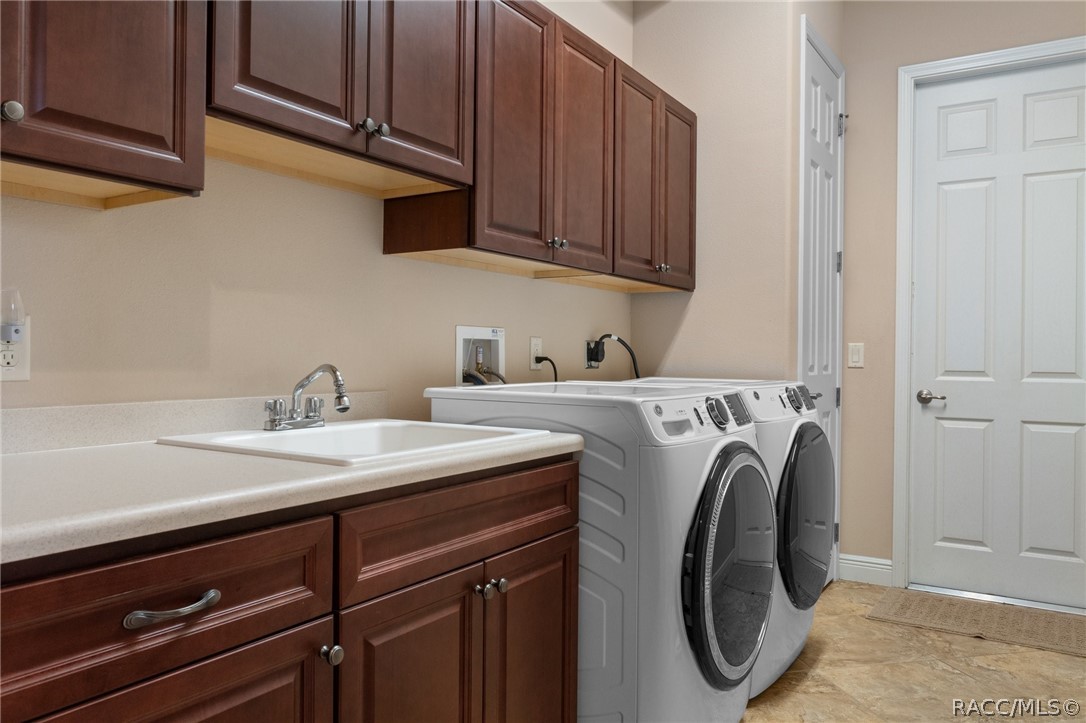 2015 North Rhodes Point Hernando, FL 34442 - Photo 29 of 82 The larger Laundry Room provides additional storage. The owners expanded the laundry room to add a closet. The door on the right leads to the garage.