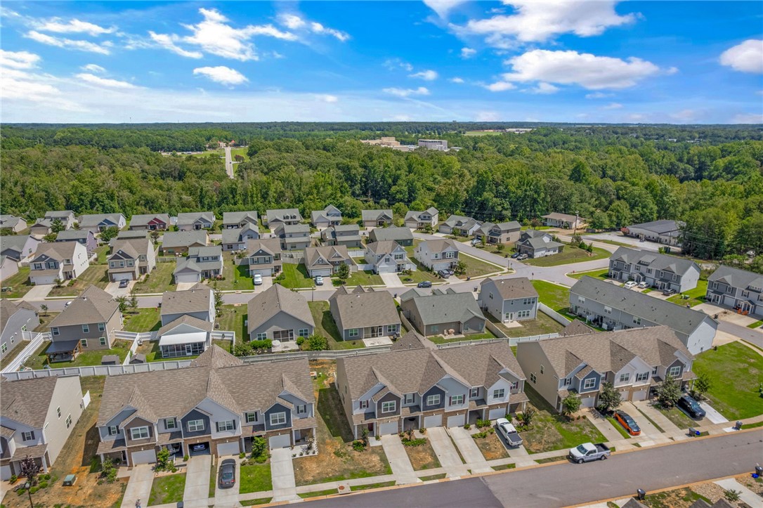 432 Bee Cv Way Pendleton, SC 29670 - Photo 35 of 39 An aerial perspective reveals a vibrant neighborhood nestled among lush, green surroundings.