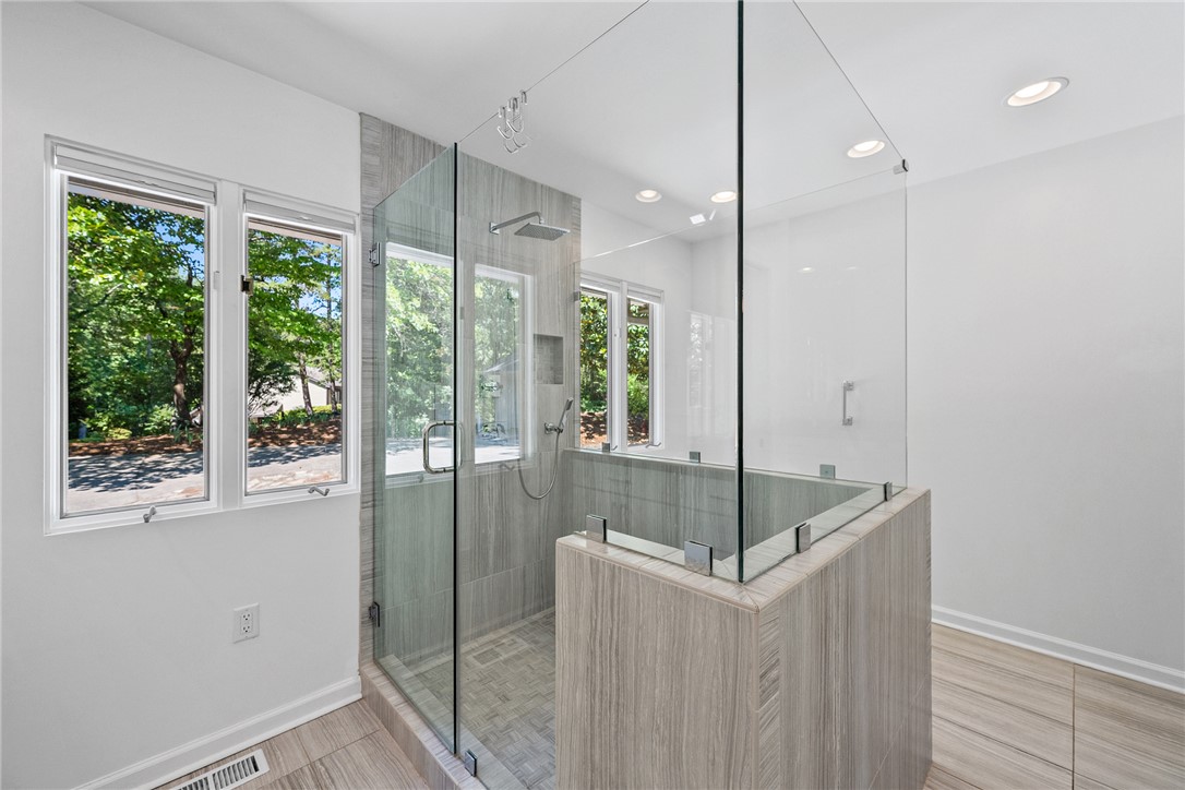 118 Beacon Ridge Circle Salem, SC 29676 - Photo 20 of 45 A naturally illuminated bathroom with a sleek, modern glass-enclosed shower.