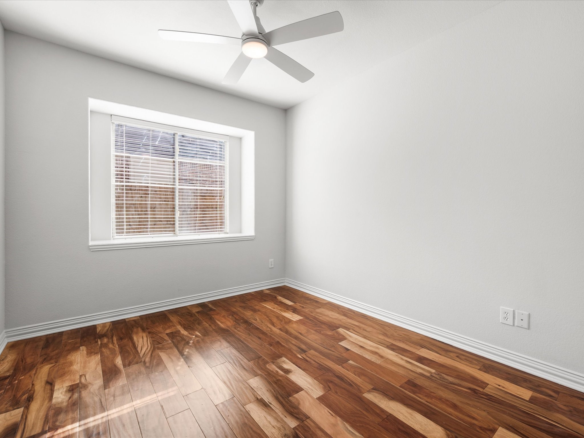 323 Arbor Ridge Lane Conroe, TX 77384 - Photo 27 of 40 Light, airy, and wide open. Those wood floors run right through, the window pulls in great afternoon sun. Make it a bedroom, an office, or whatever life calls for.