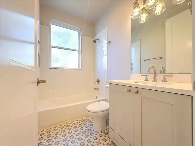 a bathroom with a shower and a sink