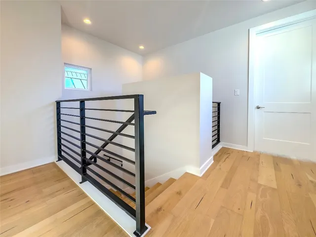 a spacious bathroom with a double vanity sink a mirror and a bathtub
