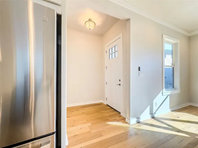 a kitchen with stainless steel appliances granite countertop a stove and a refrigerator