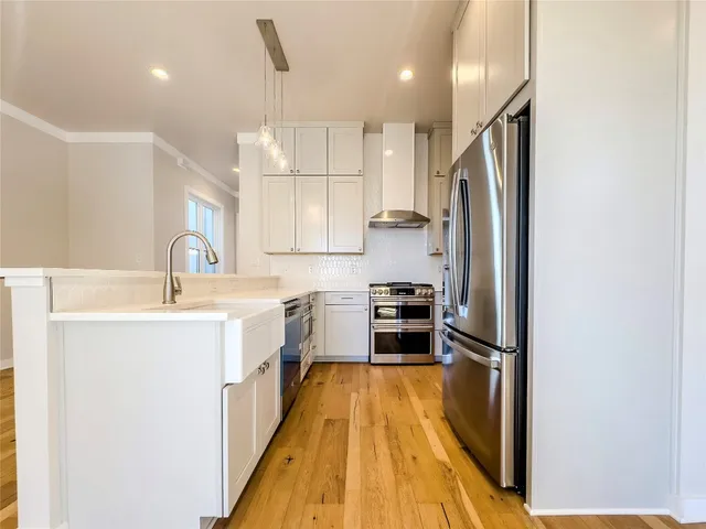 a view of a kitchen and a window