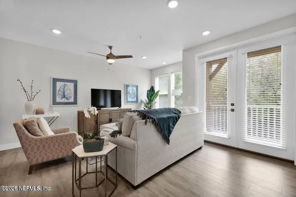 a living room with furniture and a large window