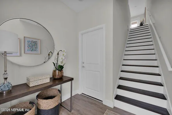 a view of entryway with wooden floor