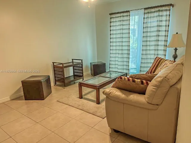 a living room with furniture and a window