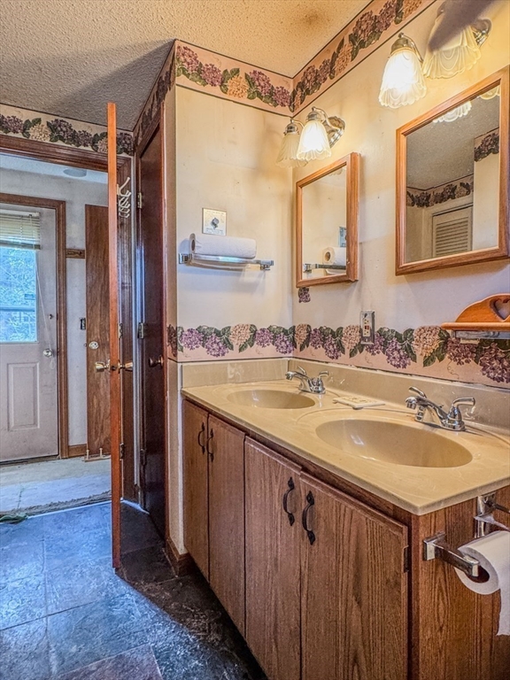 202 Turnpike Road Montague, MA 01351 - Photo 20 of 42 a bathroom with a sink and a mirror