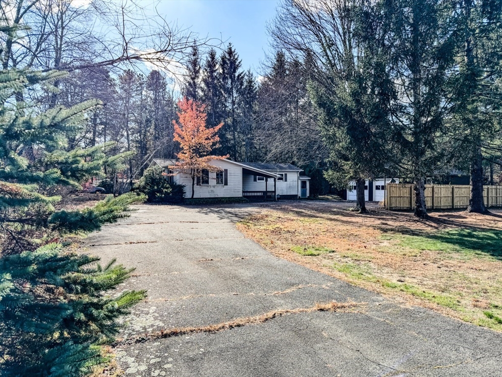 202 Turnpike Road Montague, MA 01351 - Photo 3 of 42 a house with trees in front of it