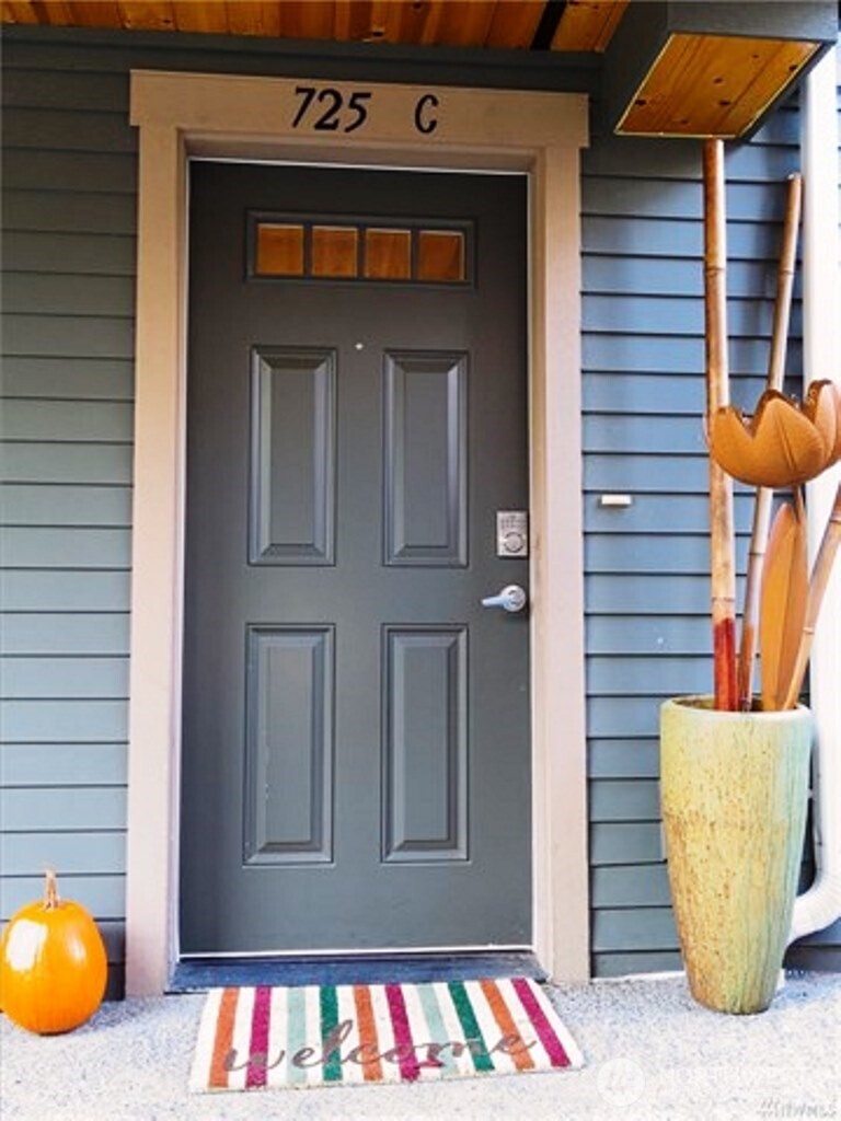 725 North 95th Street, Unit C Seattle, WA 98103 - Photo 1 of 18 a view of front door with potted plants