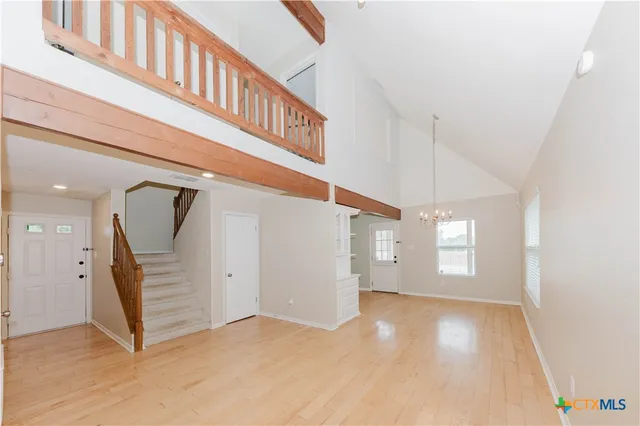 a kitchen with granite countertop a sink stainless steel appliances and cabinets