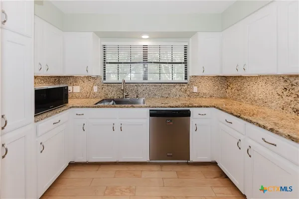 a view of a hallway with staircase