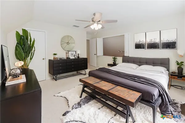 a view of a kitchen with furniture and cabinets