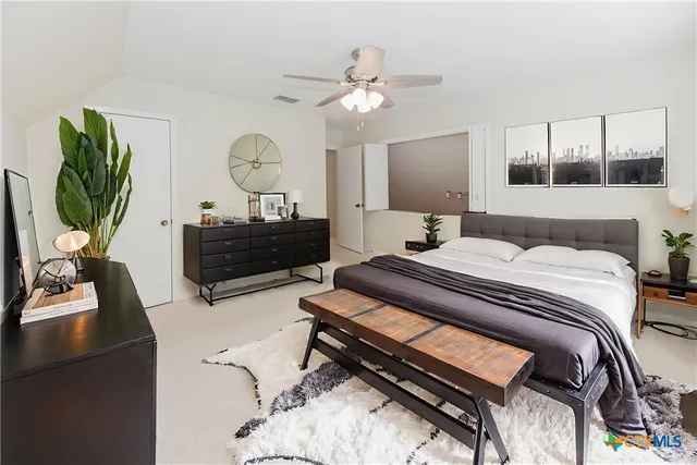 a view of a kitchen with furniture and cabinets