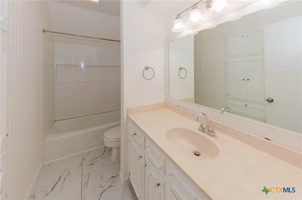 a view of a balcony with wooden floor