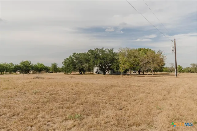 an aerial view of a house with mountain view