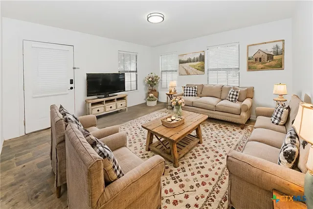 a view of kitchen with cabinets and white appliances
