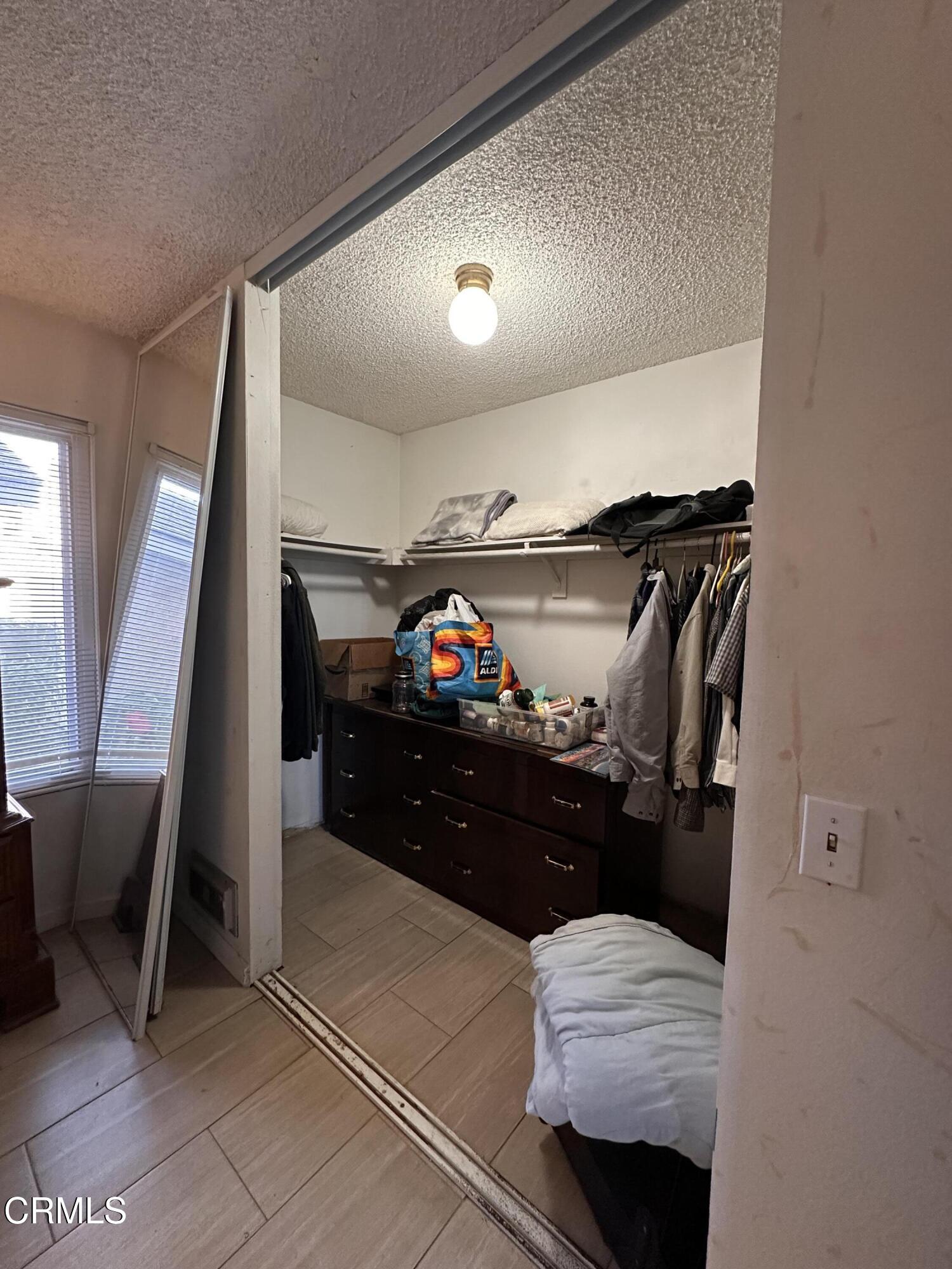 5212 Jefferson Square Oxnard, CA 93033 - Photo 10 of 12 a living room with furniture and a flat screen tv