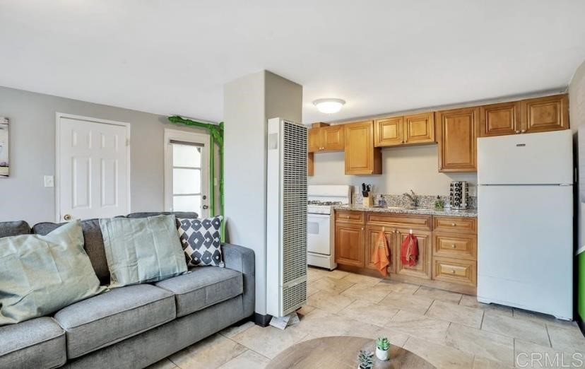 4377 Rialto Street San Diego, CA 92107 - Photo 2 of 15 a living room with granite countertop furniture and a refrigerator